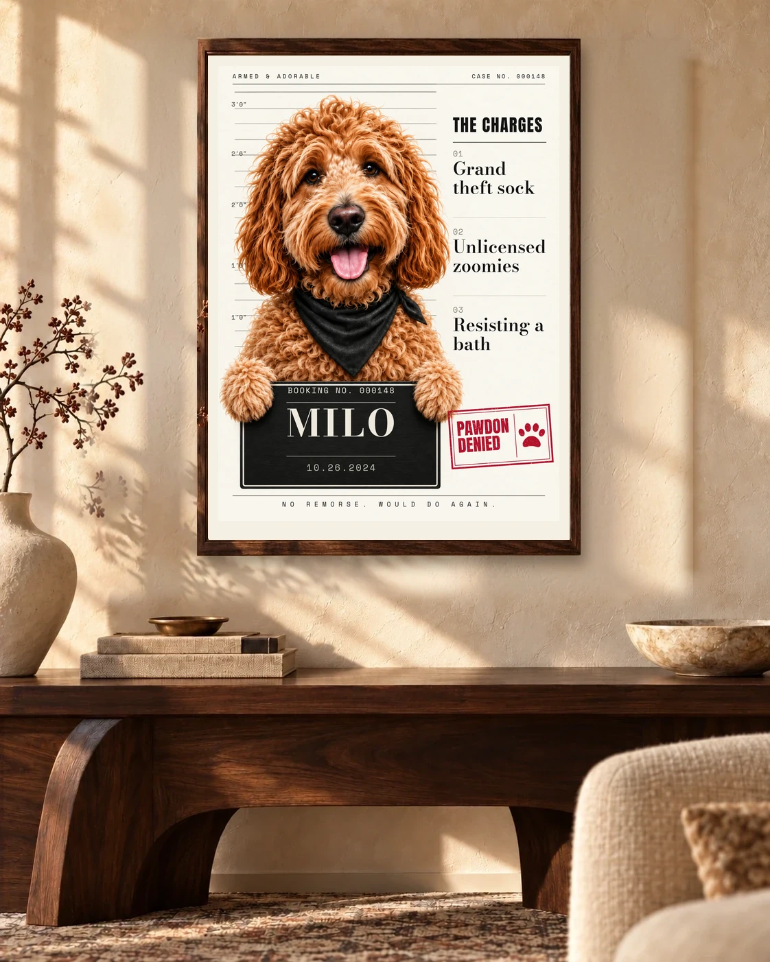 Milo’s PAWDON DENIED editorial mugshot in one wooden frame with a narrow ivory border in a sunlit living room